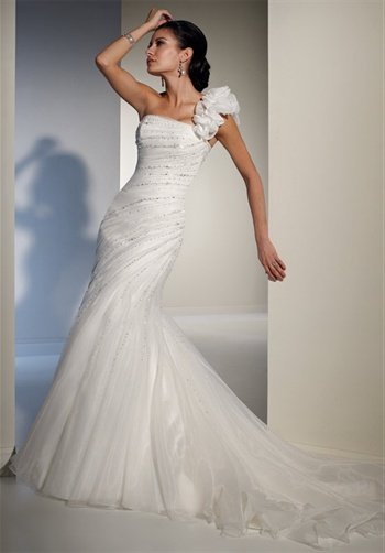 Gown features beading and corset back.